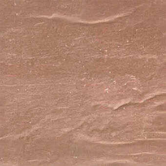 Copper laminate fabric texture with subtle waves, matte finish, and white flecks; egoitaliano “lamina rame” sample card detail visible.